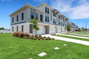 RISE Citrus Ridge elevated design townhomes in Davenport, Florida: Exterior Front Yard with Driveway of Community