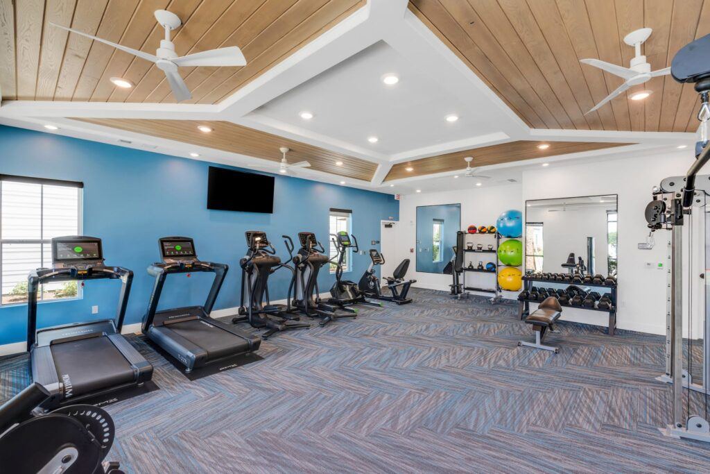 RISE Citrus Ridge elevated design townhomes in Davenport, Florida: Interior Fitness Center Gym with Treadmills and Ellipticals