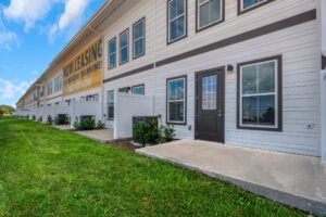 RISE Citrus Ridge elevated design townhomes in Davenport, Florida: Exterior Backyard Porch of Community