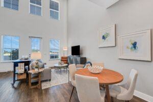 RISE Citrus Ridge elevated design townhomes in Davenport, Florida: Interior In-unit Loft with Living Room and Dining Table