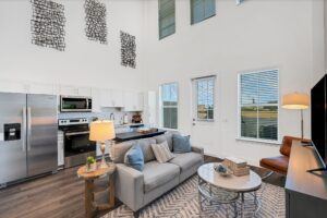 RISE Citrus Ridge elevated design townhomes in Davenport, Florida: Interior In-unit Loft with Kitchen and Living Room 2
