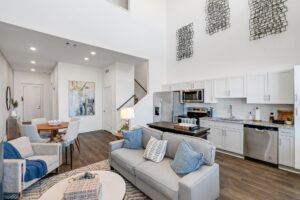 RISE Citrus Ridge elevated design townhomes in Davenport, Florida: Interior In-unit Loft with Kitchen and Living Room