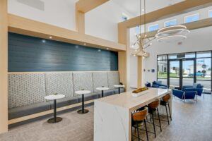 RISE Citrus Ridge elevated design townhomes in Davenport, Florida: Clubhouse Lobby with Modern Lighting and Fixtures